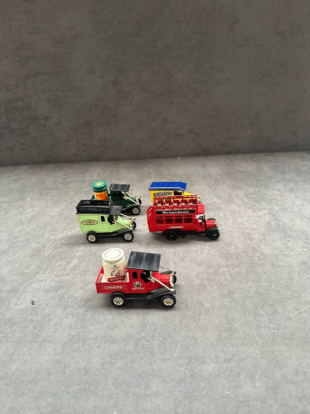 Lot 131: A Collection of Five Die-Cast Model Commercial Vehicles with British Heritage Promotional Liveries