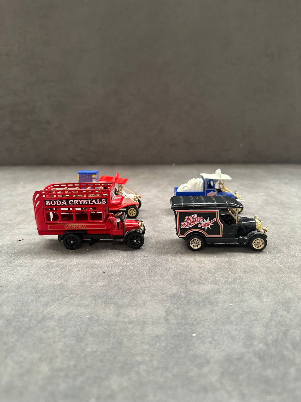 Lot 134: Four miniature die-cast promotional delivery vehicles including Soda Crystals and General liveried models