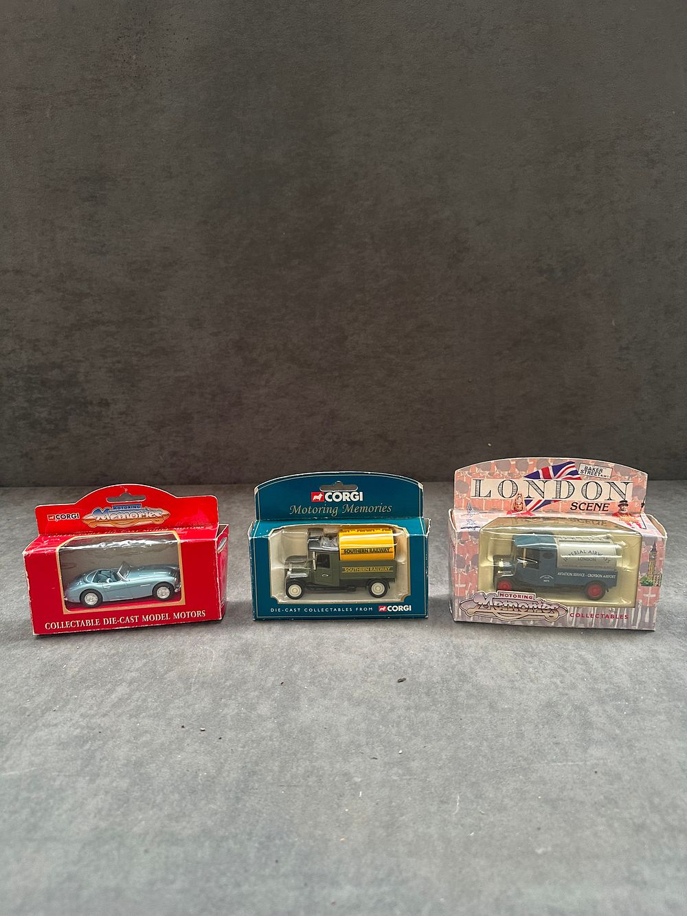 Lot 147: Three Corgi Motoring Memories die-cast model vehicles in original window display boxes