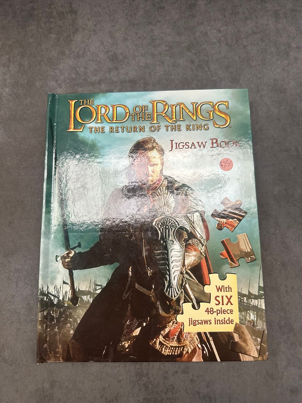 Lot 235: THE LORD OF THE RINGS THE RETURN OF THE KING JIGSAW BOOK WITH SIX PUZZLES