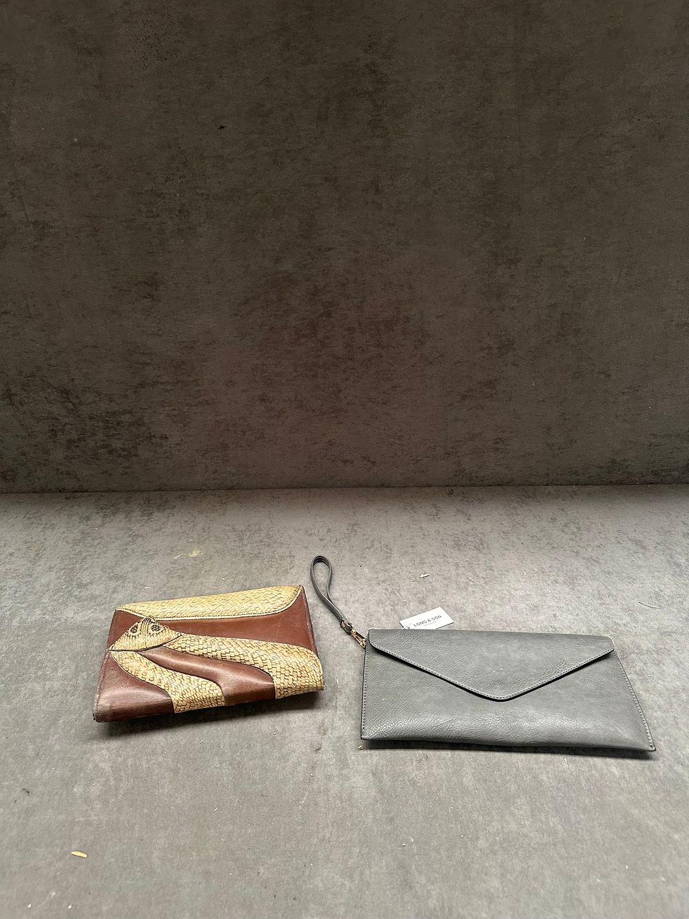 Lot 466: Two clutch bags including a Long & Son London envelope wristlet and a vintage leather and exotic skin panelled clutch