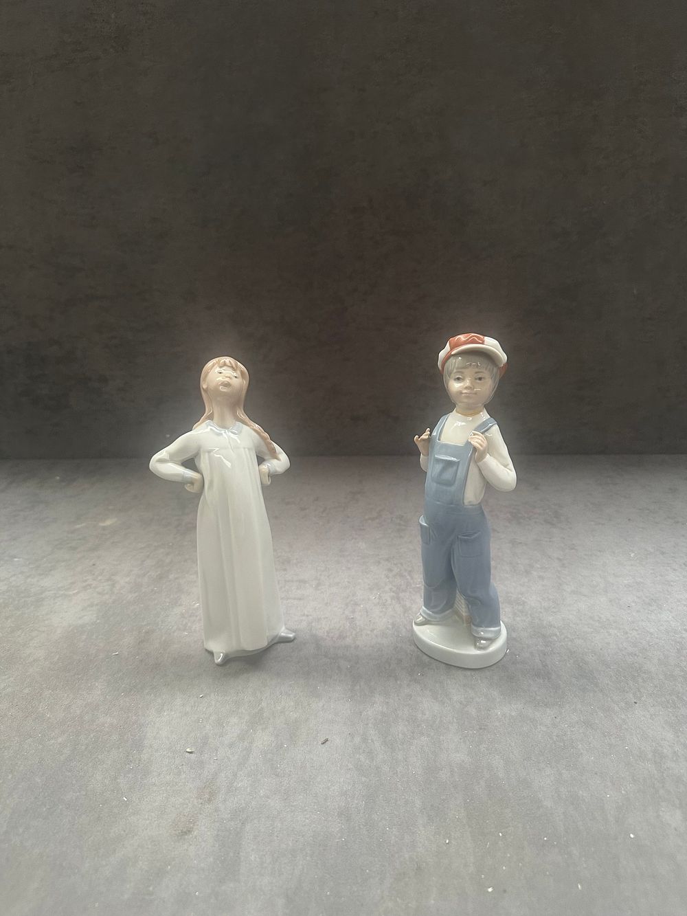 Lot 405: Two Lladro Glazed Porcelain Figurines Including Boy from Madrid and Girl in Nightgown