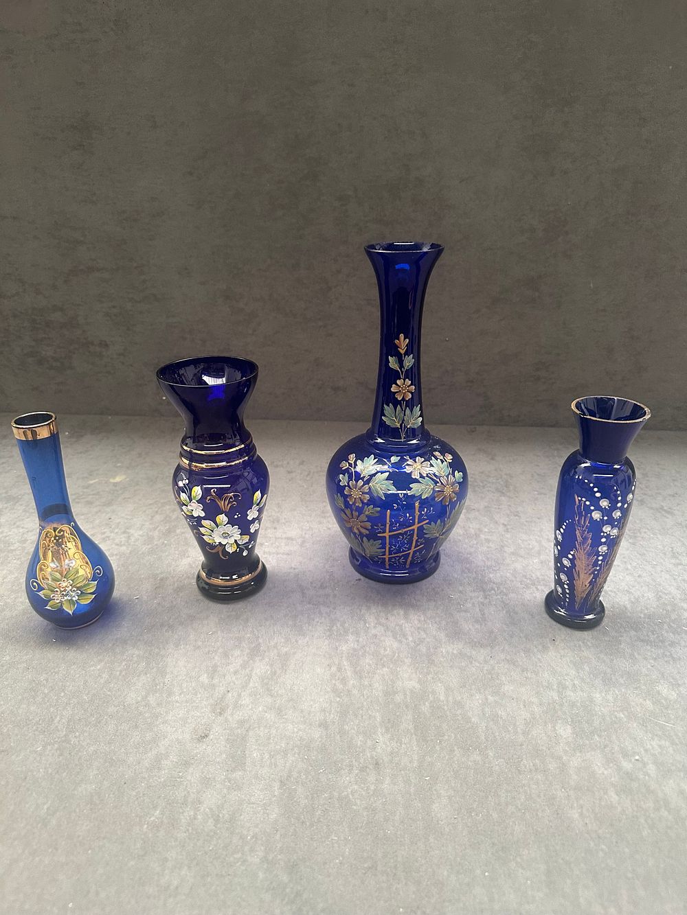 Lot 409: A Set of Four Enamelled Cobalt Blue Glass Vases