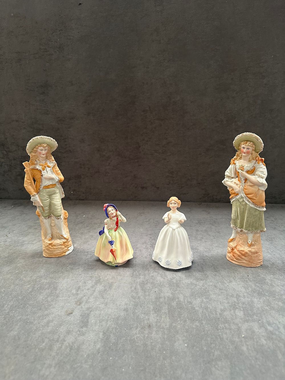 Lot 412: A Collection of Four Royal Doulton and Other Ceramic Figurines