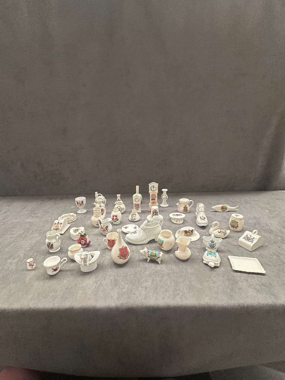 Lot 477: A Collection of British Souvenir Crested China Miniatures including Arcadian Examples
