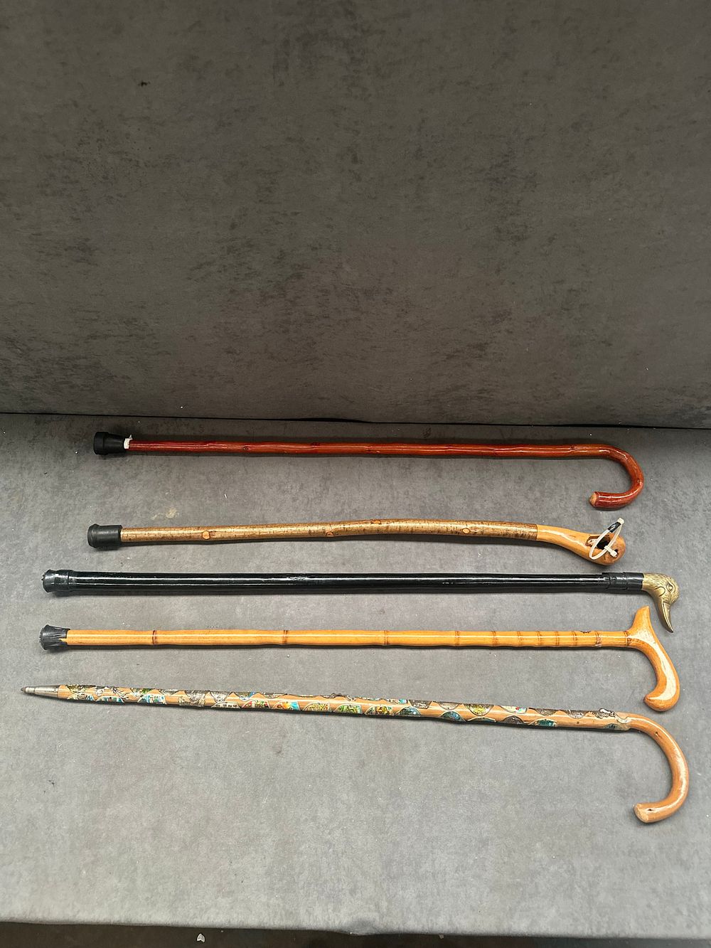 Lot 480: An Assortment of Five Miscellaneous Wooden Walking Sticks and Canes