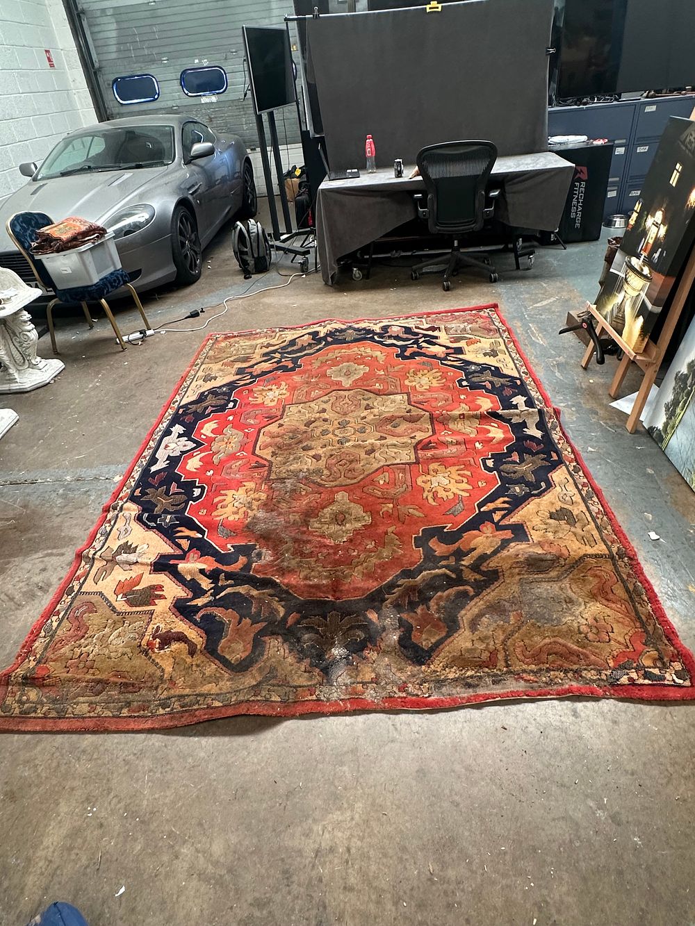 Lot 483: A Large Persian Heriz Hand-Knotted Wool Carpet (Bad Condition)