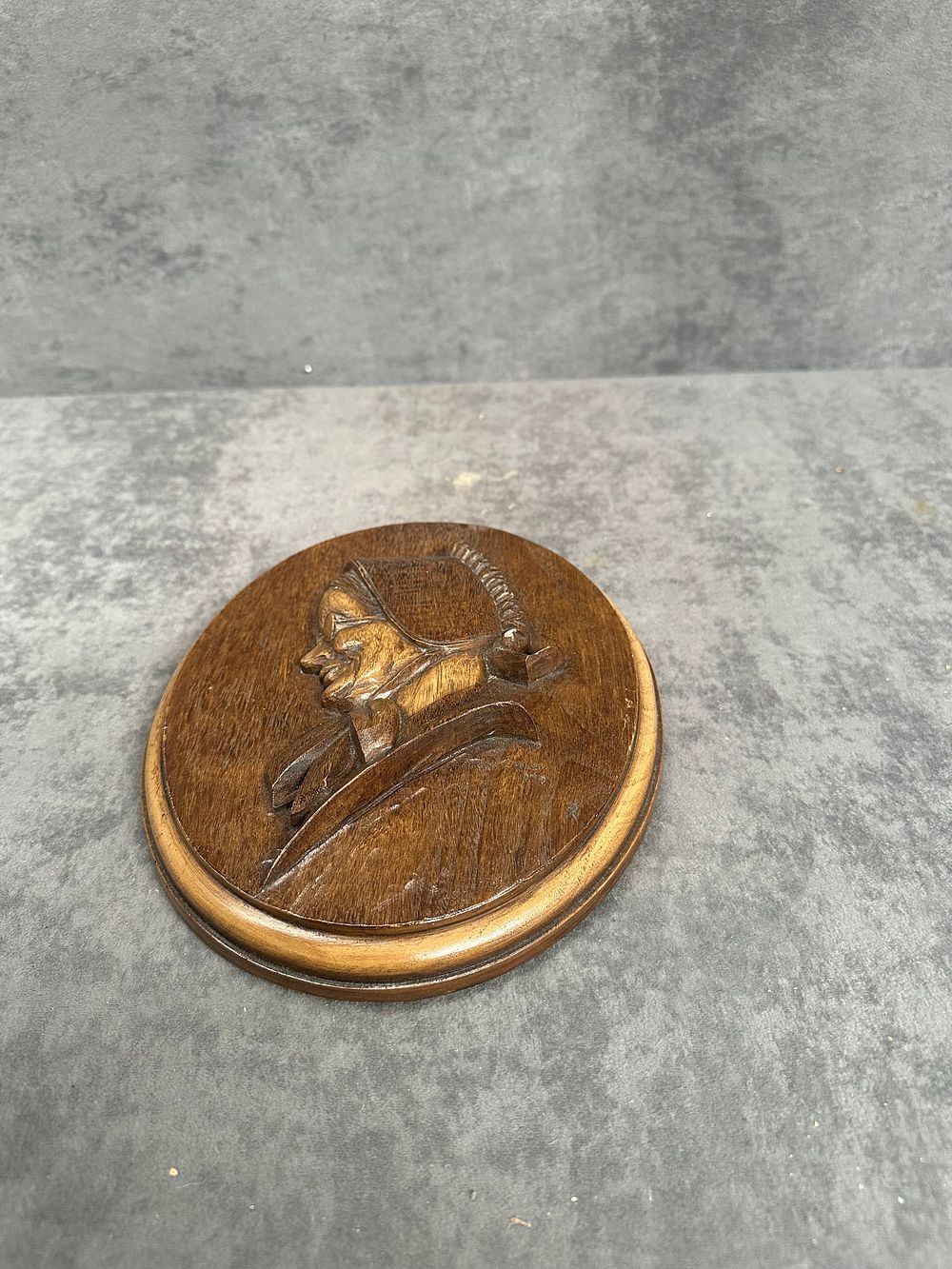Lot 489: A Canadian Relief-Carved Wooden Wall Plaque Mennonite Lady by Karl Rothammer
