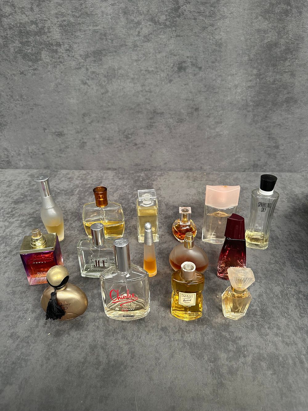 Lot 491: A Collection of Assorted Fragrance and Perfume Bottles Including Revlon and Milton-Lloyd