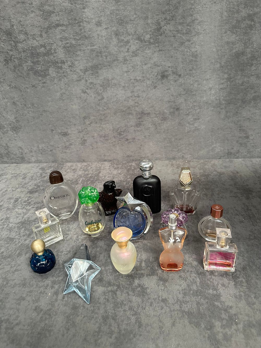 Lot 492: A Collection of Twelve Designer Miniature and Travel Scent Bottles