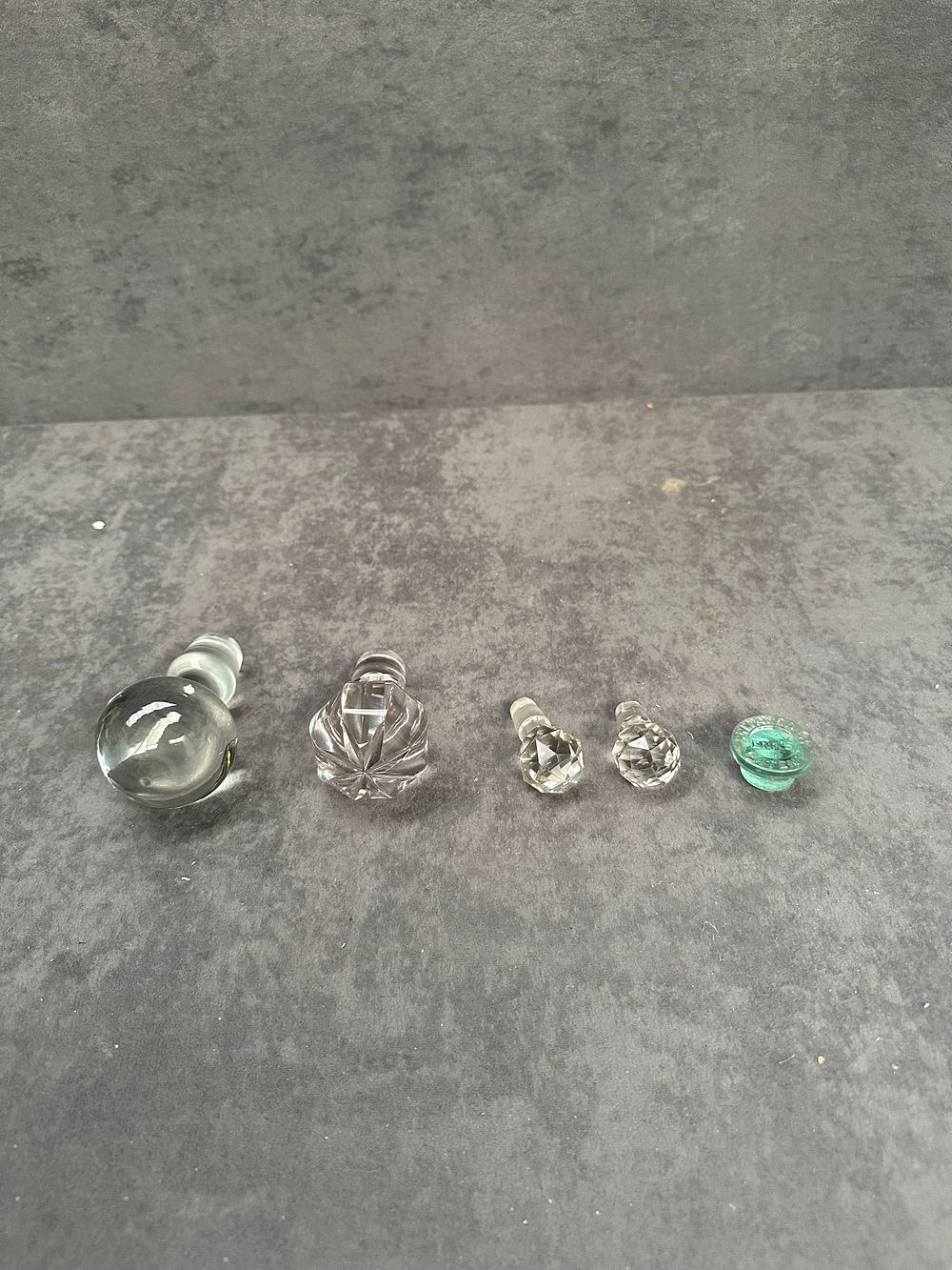 Lot 427: An Assortment of Glass and Crystal Bottle Stoppers