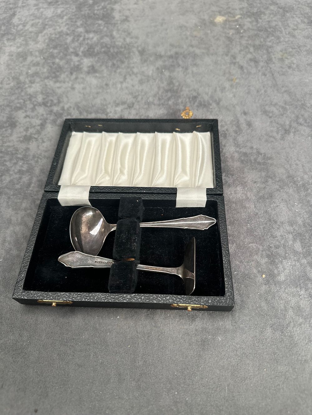 Lot 495: A Cased Art Deco Sterling Silver Child's Spoon and Food Pusher