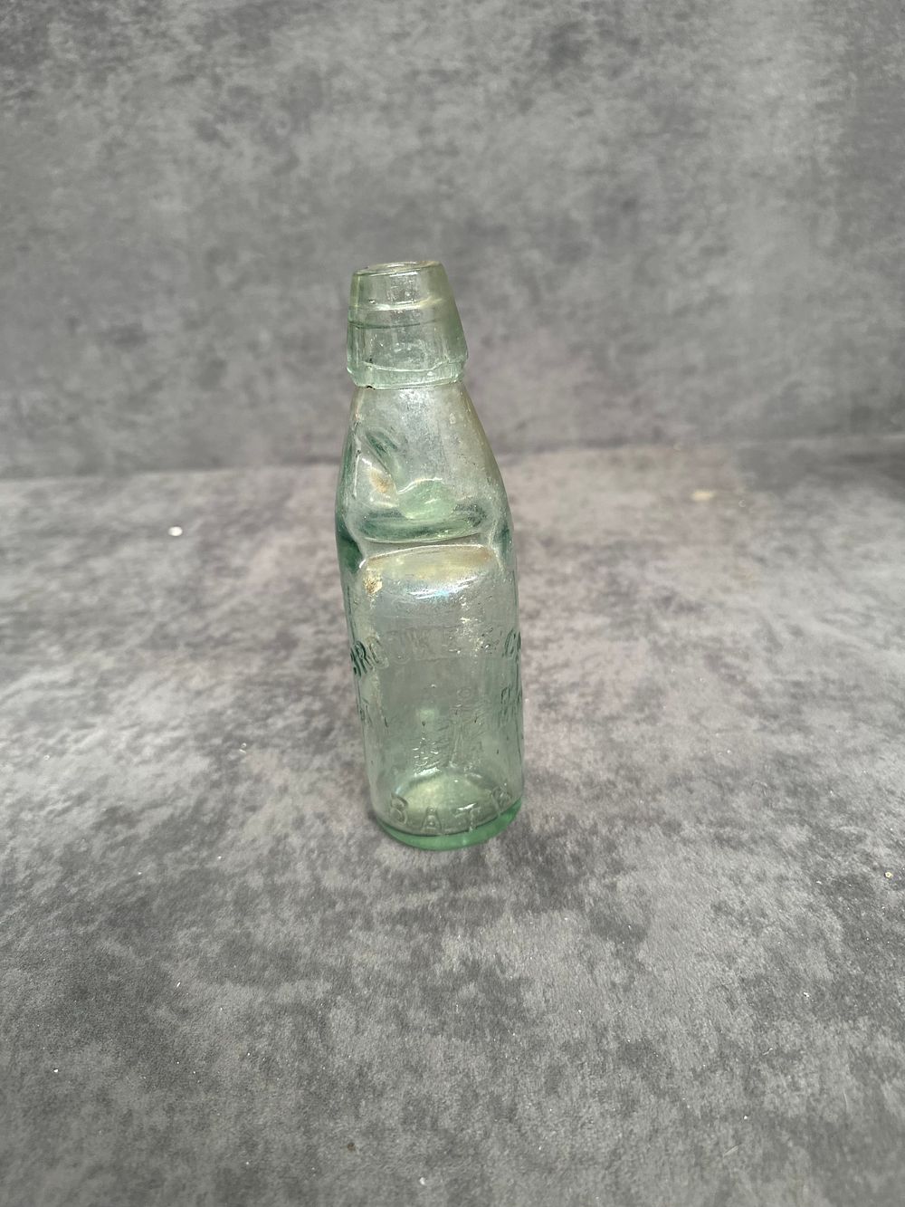Lot 433: A Late Victorian Aqua Glass Brooke and Batley Codd-neck Mineral Water Bottle