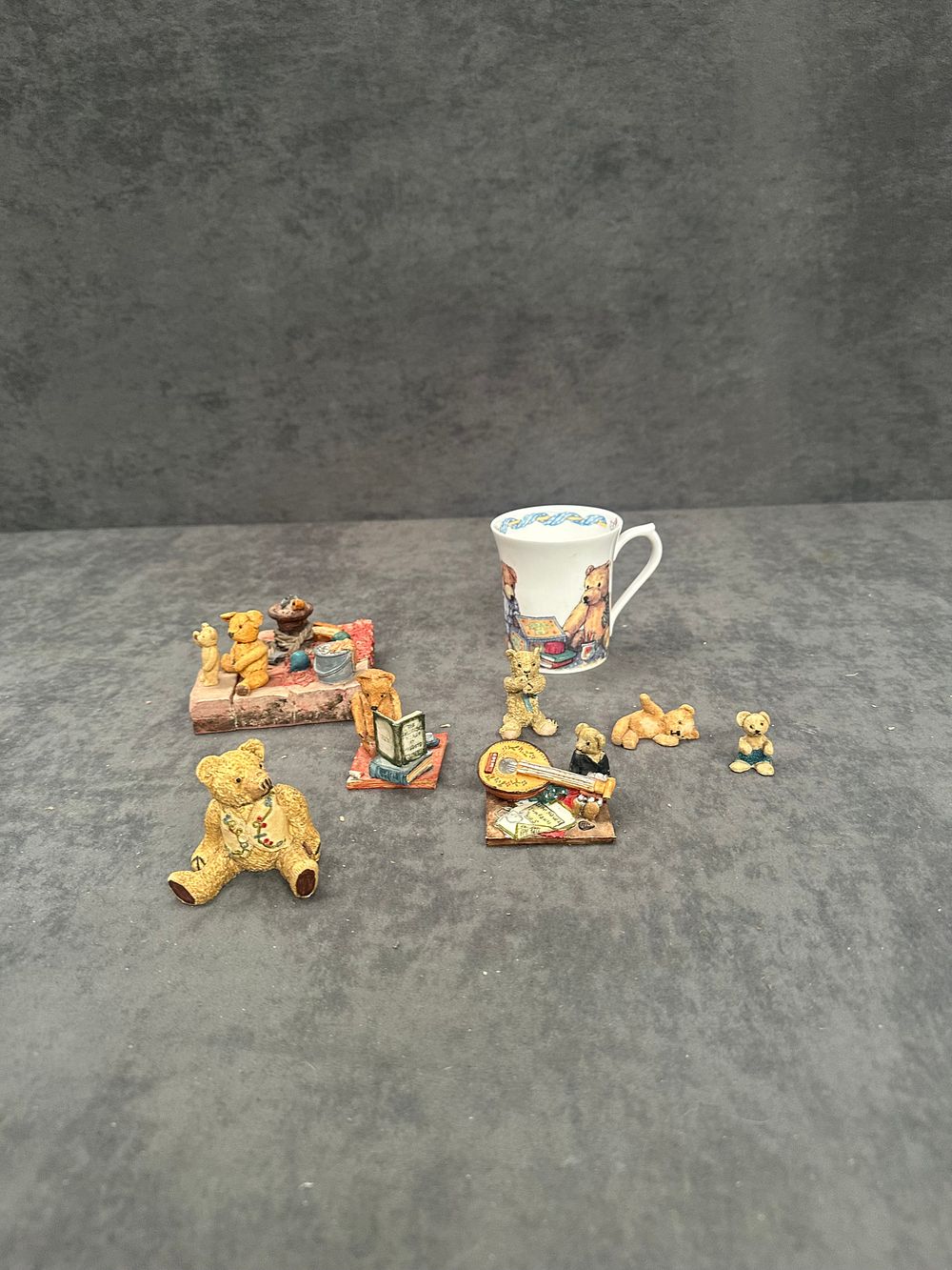 Lot 439: A Collection of Miniature Teddy Bear Figurines and a Miniature Mug