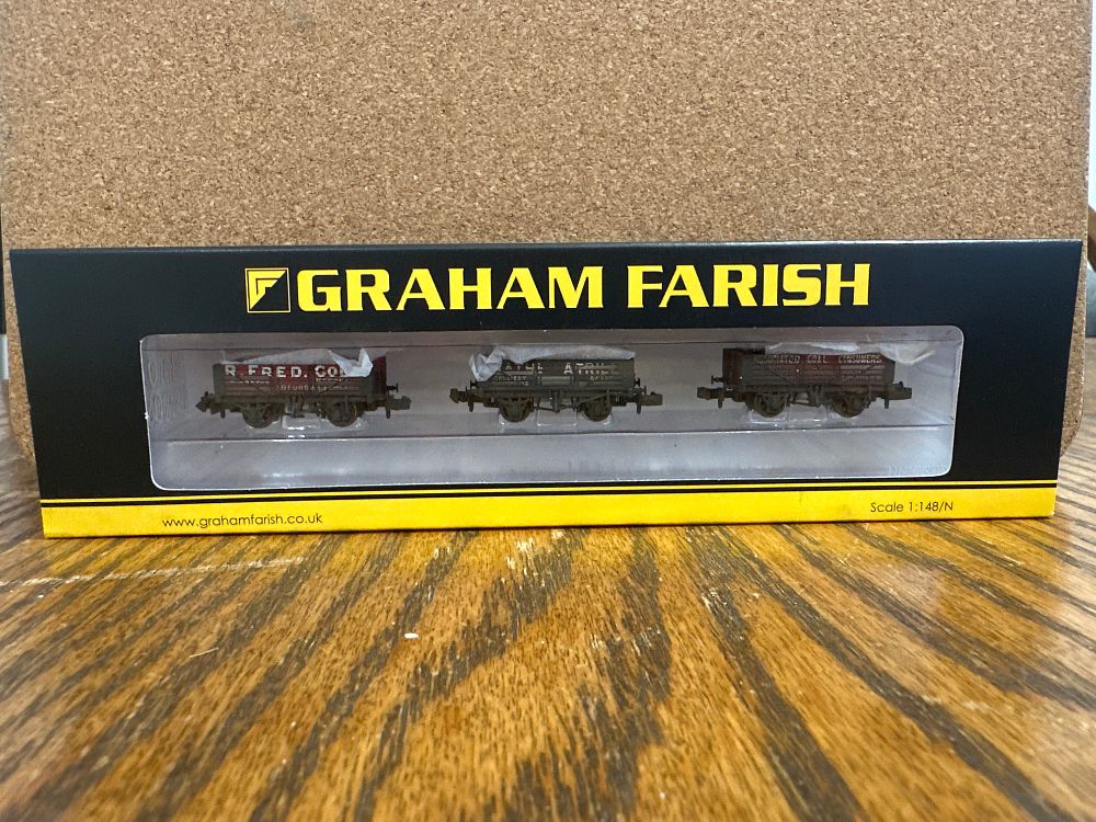 Lot 175: A Graham Farish N Gauge Coal Trader Triple Pack of Weathered 5 Plank Wagons
