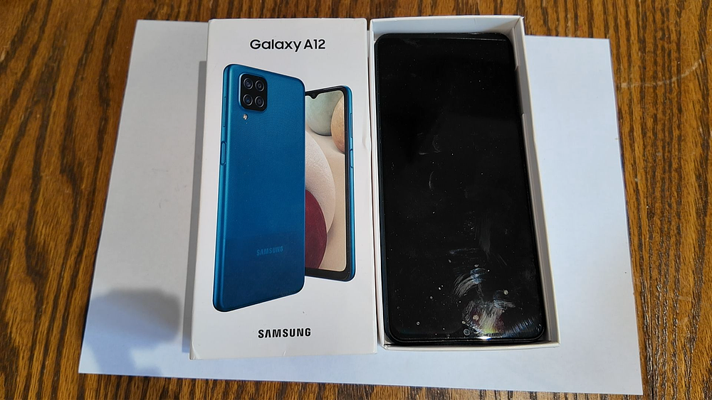 Lot 358: Samsung Galaxy A12 Blue 64GB Smartphone and Original Box