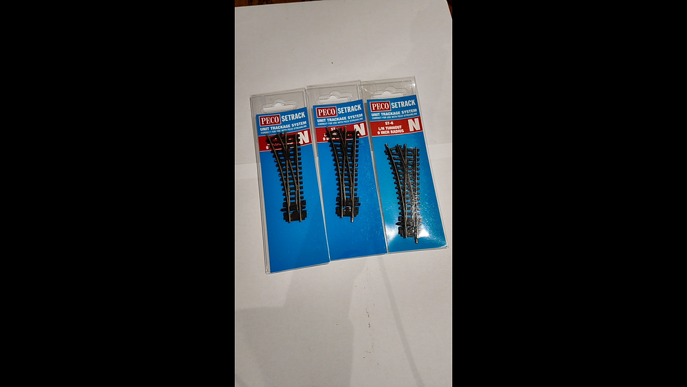 Lot 209: Three Peco Setrack N Gauge ST-6 Left Hand Turnouts in Original Packaging