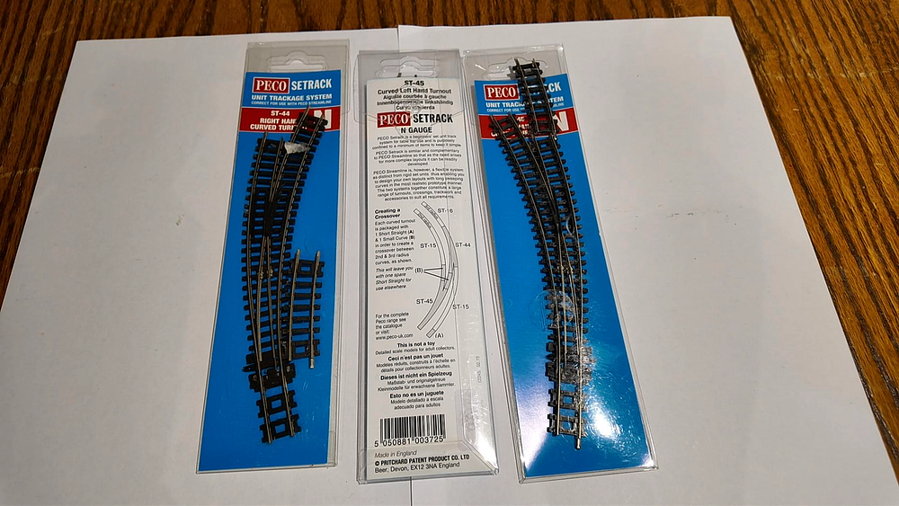 Lot 213: Three Peco Setrack N Gauge Curved Turnouts Including Models ST-44 and ST-45