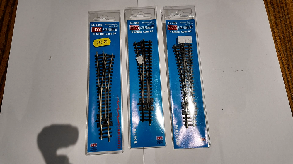 Lot 217: Three Peco Streamline N Gauge Code 80 Medium Radius Turnouts