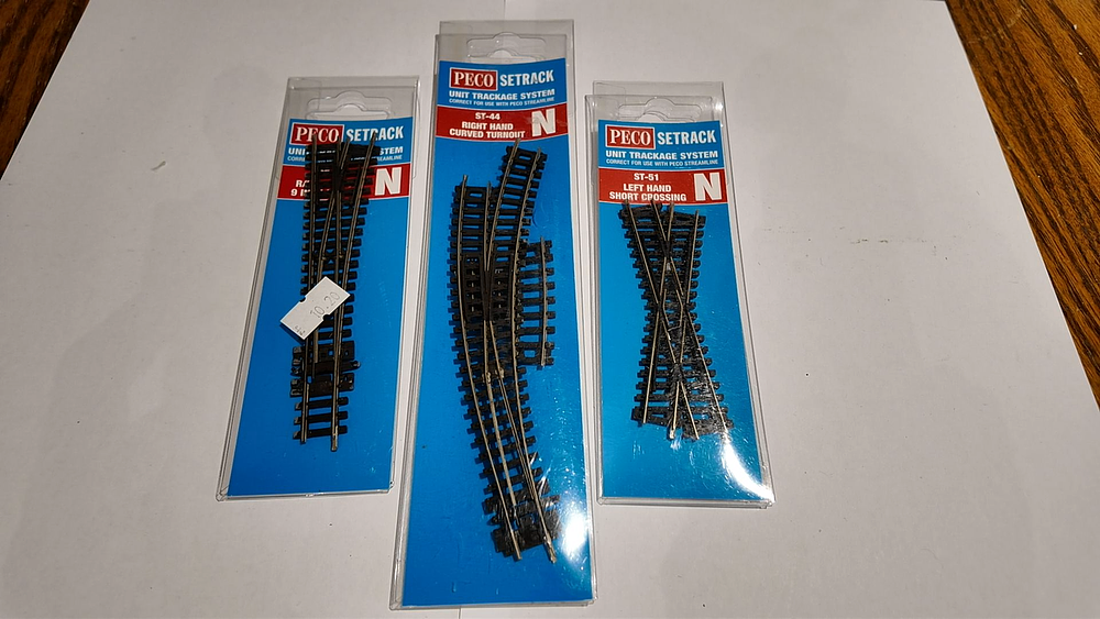 Lot 219: Three Peco Setrack N Gauge Model Railway Track Components in Original Packaging