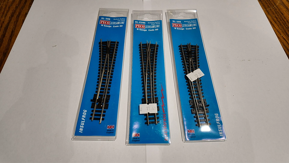 Lot 220: Three Peco Streamline N Gauge Code 80 Medium Radius Turnouts