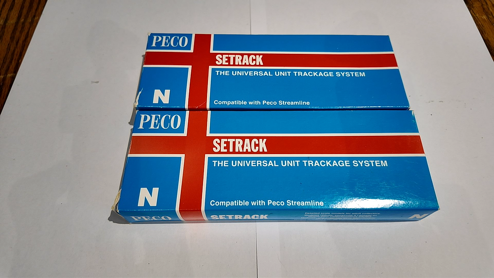 Lot 221: A Pair of Peco Setrack N Gauge Model Railway Track Boxes Containing Straight Track Sections
