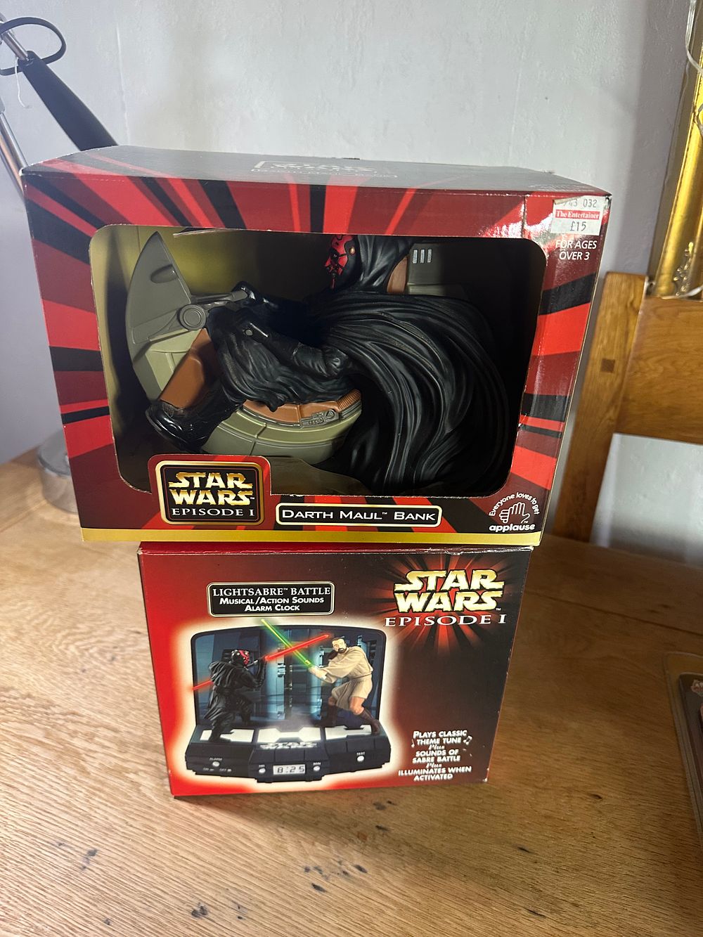 Lot 297: A Pair of Star Wars Episode I Applause Collectibles comprising a Darth Maul Bank and a Lightsabre Battle Alarm Clock