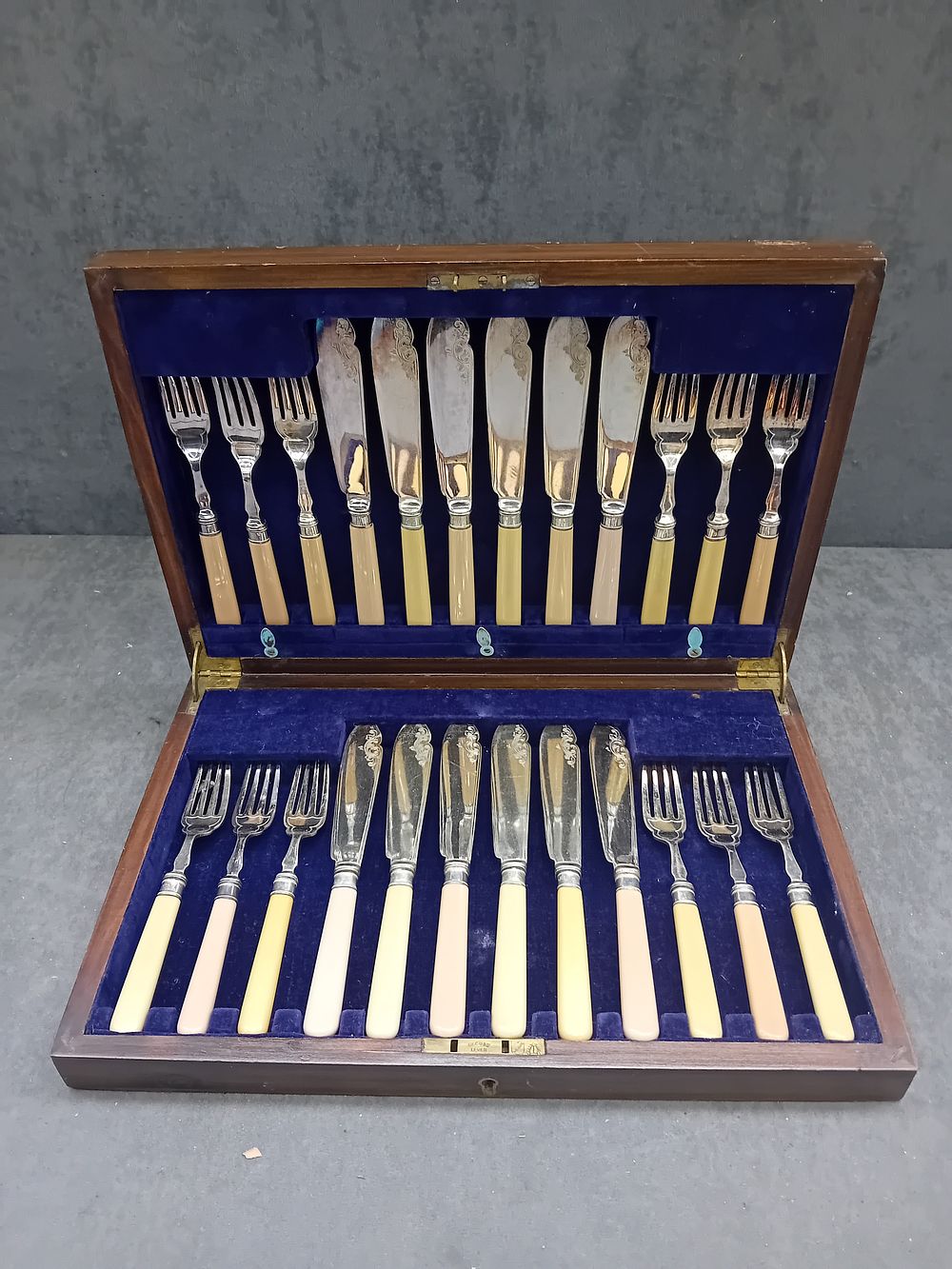 Lot 605: A Cased Set of Twenty-Four EPNS Fish Knives and Forks, Early 20th Century