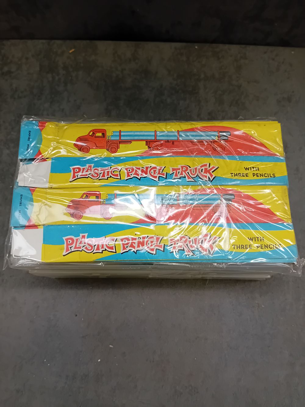 Lot 35: Plastic pencil trucks there are 9 in total...