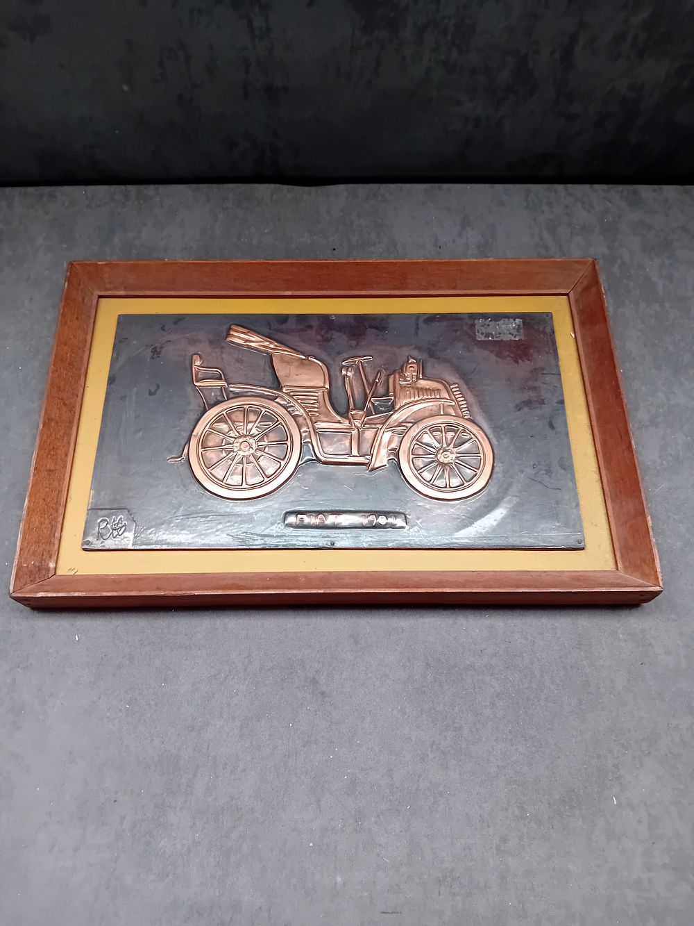Lot 46: A Framed Metal Relief of a Fiat 1901, Hand Wrought by Richard C. Hanscomb