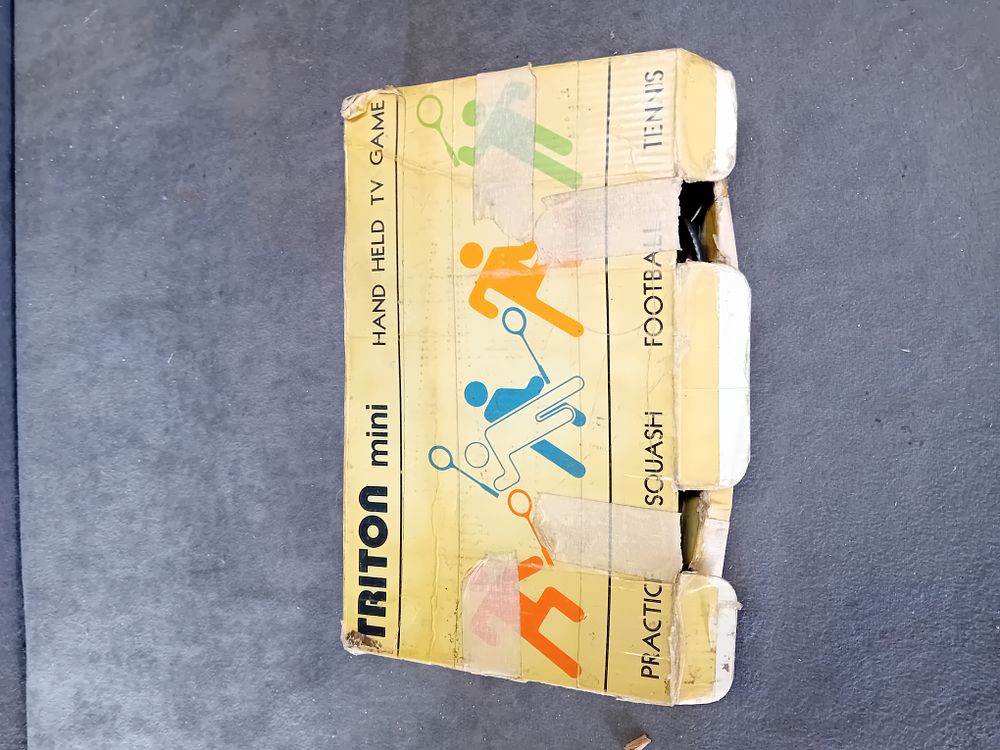 Lot 327: TRITON MINI HANDHELD TV GAME SYSTEM WITH BOX