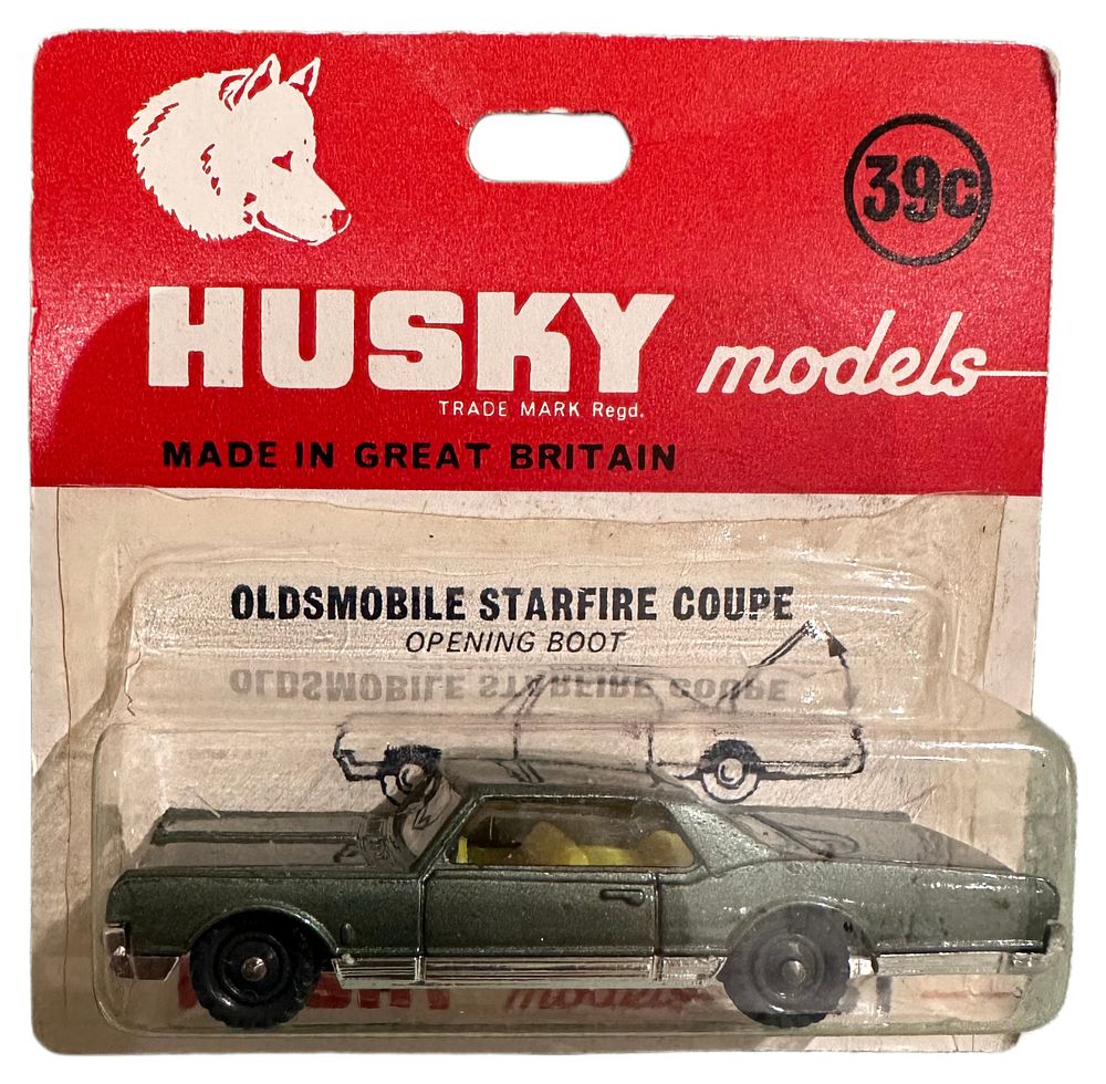 Lot 153: Husky Models No. 31 Oldsmobile Starfire Coupe Carded Die-Cast Model Car