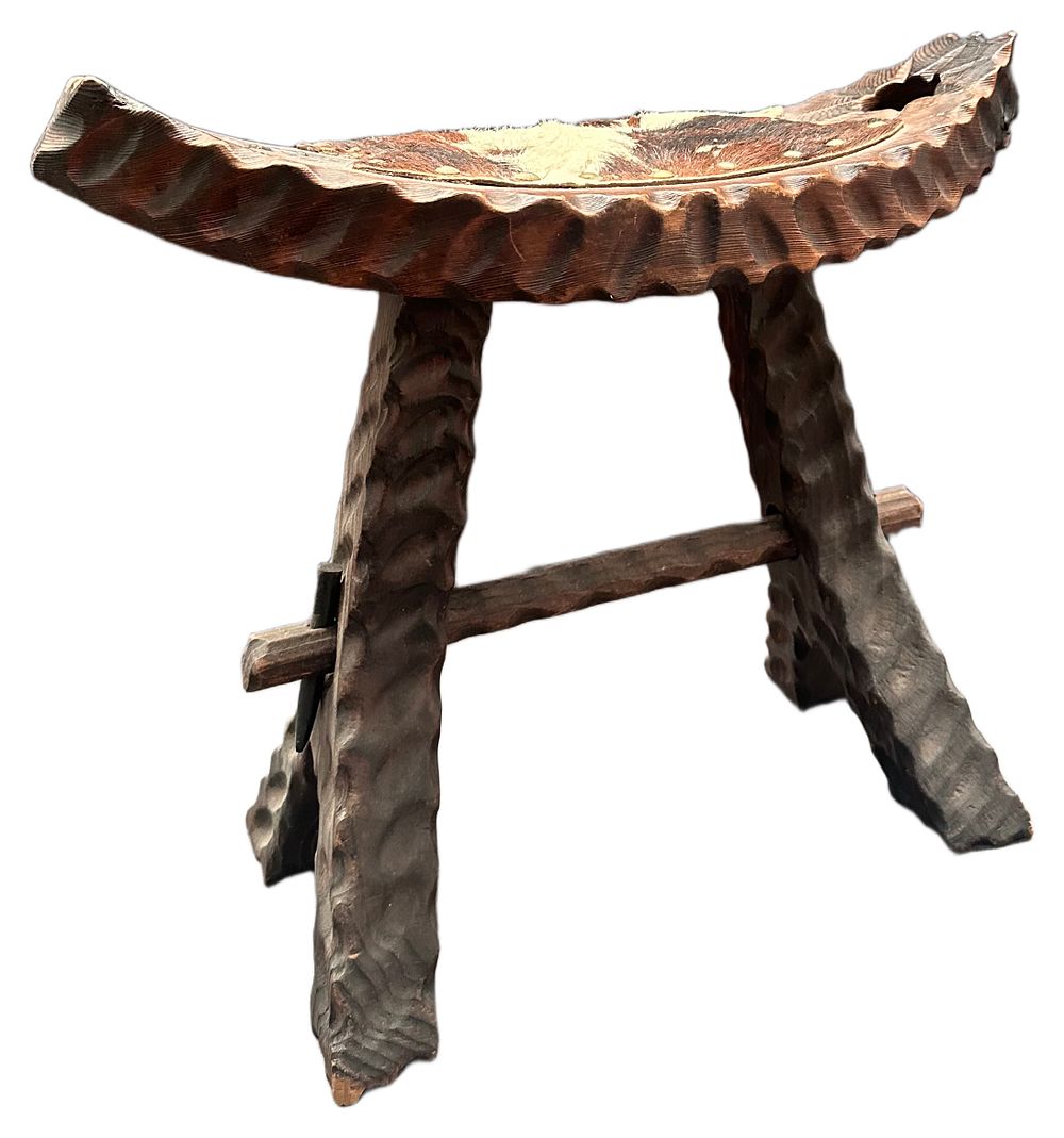 Lot 615: A hand-carved hardwood and animal hide tripod stool, East Africa