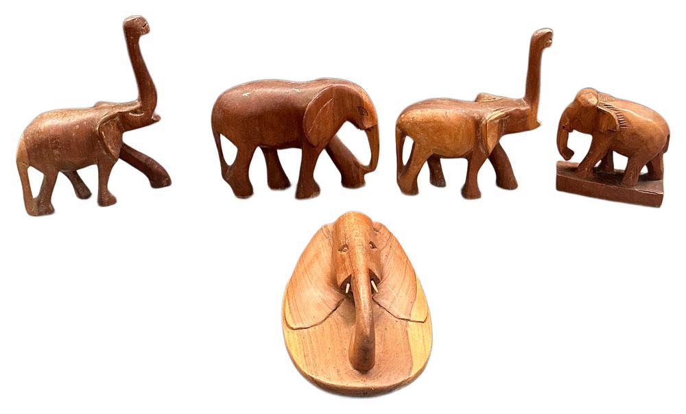 Lot 617: A Collection of Hand Carved Hardwood Elephant Figurines and Wall Plaque