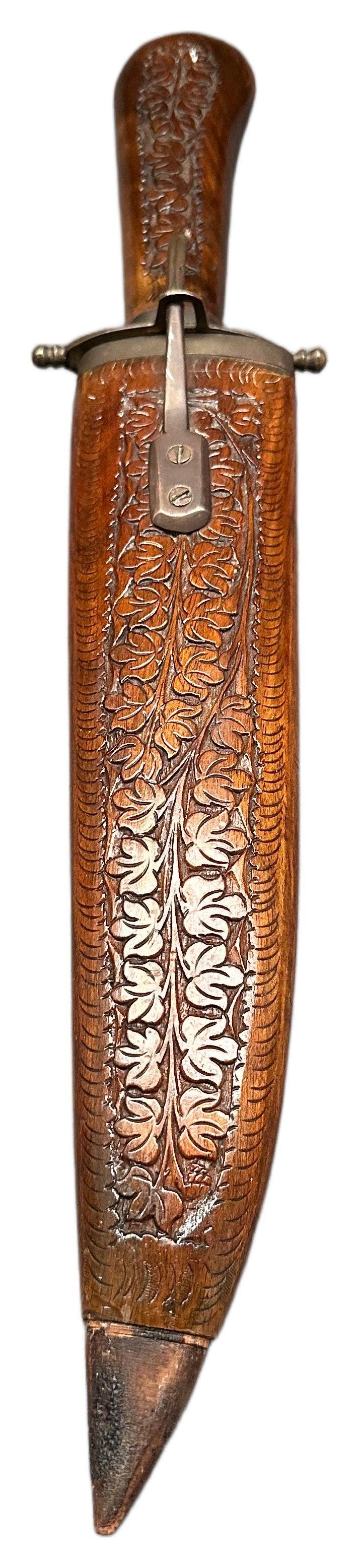 Lot 19: A carved wood-hilted souvenir dagger and scabbard, India, mid-to-late 20th century