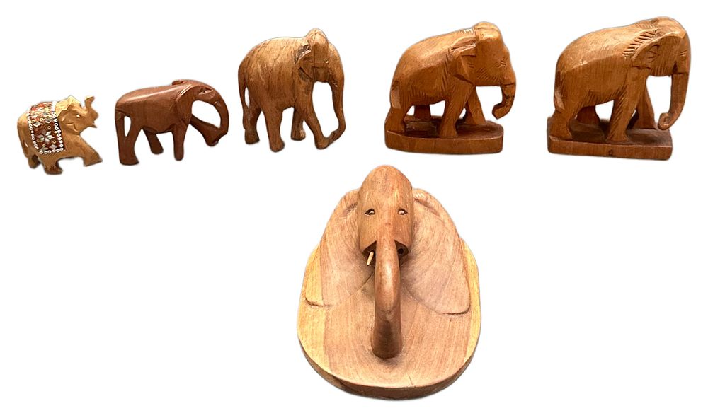 Lot 620: A Collection of Hand Carved Wooden Elephant Figurines and Wall Plaque