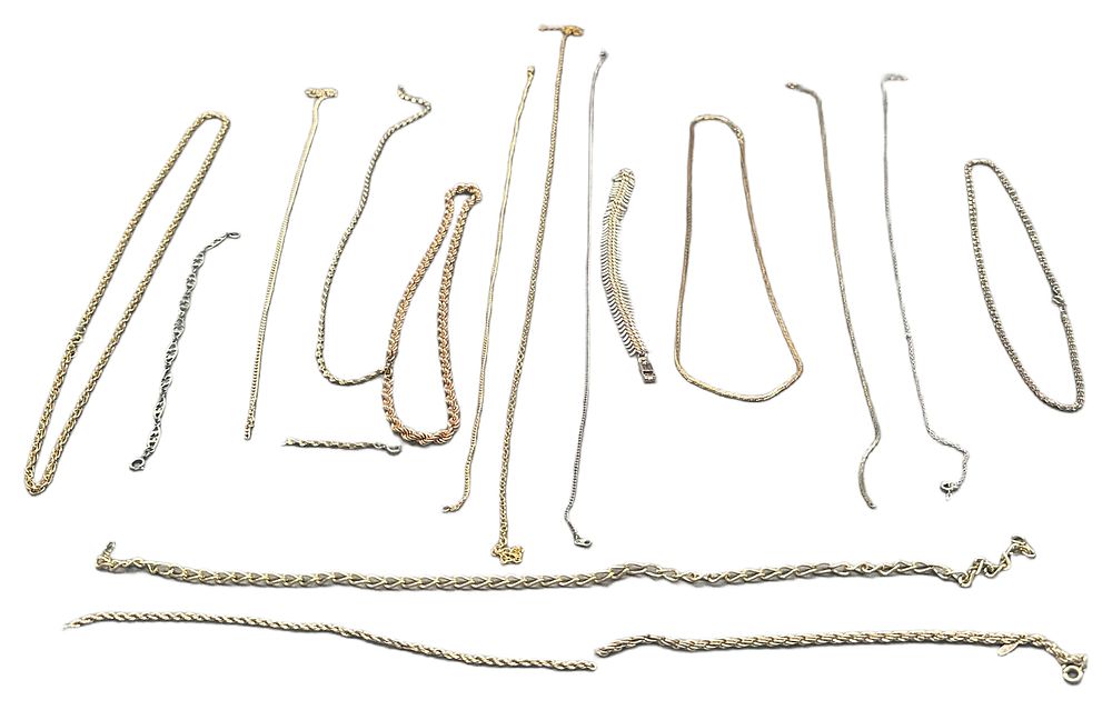 Lot 649: A Collection of Yellow, White and Rose Metal Neck Chains and Bracelets
