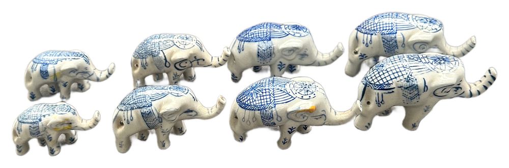 Lot 461: A Collection of Eight Blue and White Glazed Ceramic Elephant Figurines