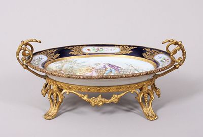 Centerpiece in the S&egrave;vres style, France, circa 1900 Porcelain, polychrome painted, in a gilt 