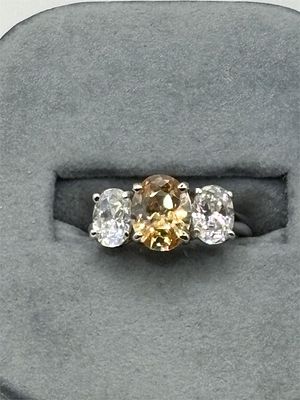 Sterling Ring with Synthetic Citrine and Stones. Size 6 1/43.6 gramsMarked "925 ChariZma"