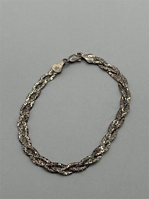 Sterling Braided Bracelet. 7.5 inches5.5 gramsMarked "Italy"