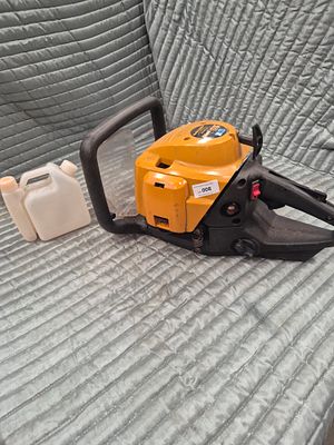 McCulloch Gladiator 550 Petrol-Powered Chainsaw Power Head and Fuel Mixing Bottle. A McCulloch 
