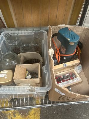 A Collection comprising a Corded Plunge Router, a Cased Set of Router Bits, and an Assortment 