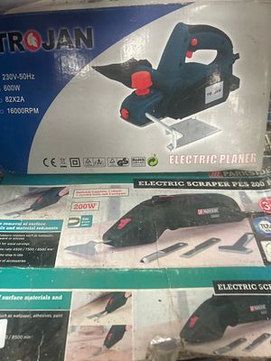 Two Corded Power Tools comprising a Trojan Electric Planer and a Parkside Electric Scraper. A 