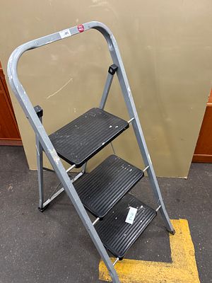 An ECM Housewares Grey Painted Steel Three-Step Folding Ladder. An ECM Housewares folding 