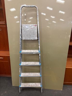 A Beldray five-tread aluminium folding stepladder. A domestic five-tread folding stepladder 