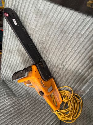 Partner 640 electric chainsaw with bar cover. An electric chainsaw by Partner featuring an 