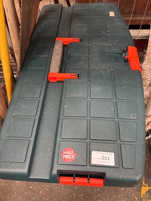 Assortment of Hand Tools and DIY Hardware in a Portable Green Plastic Toolbox. An assortment of 
