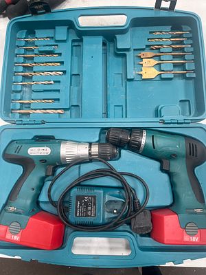 A Twin Set of 18V Cordless Drills with Accessories and Carry Case. A cordless power tool set 