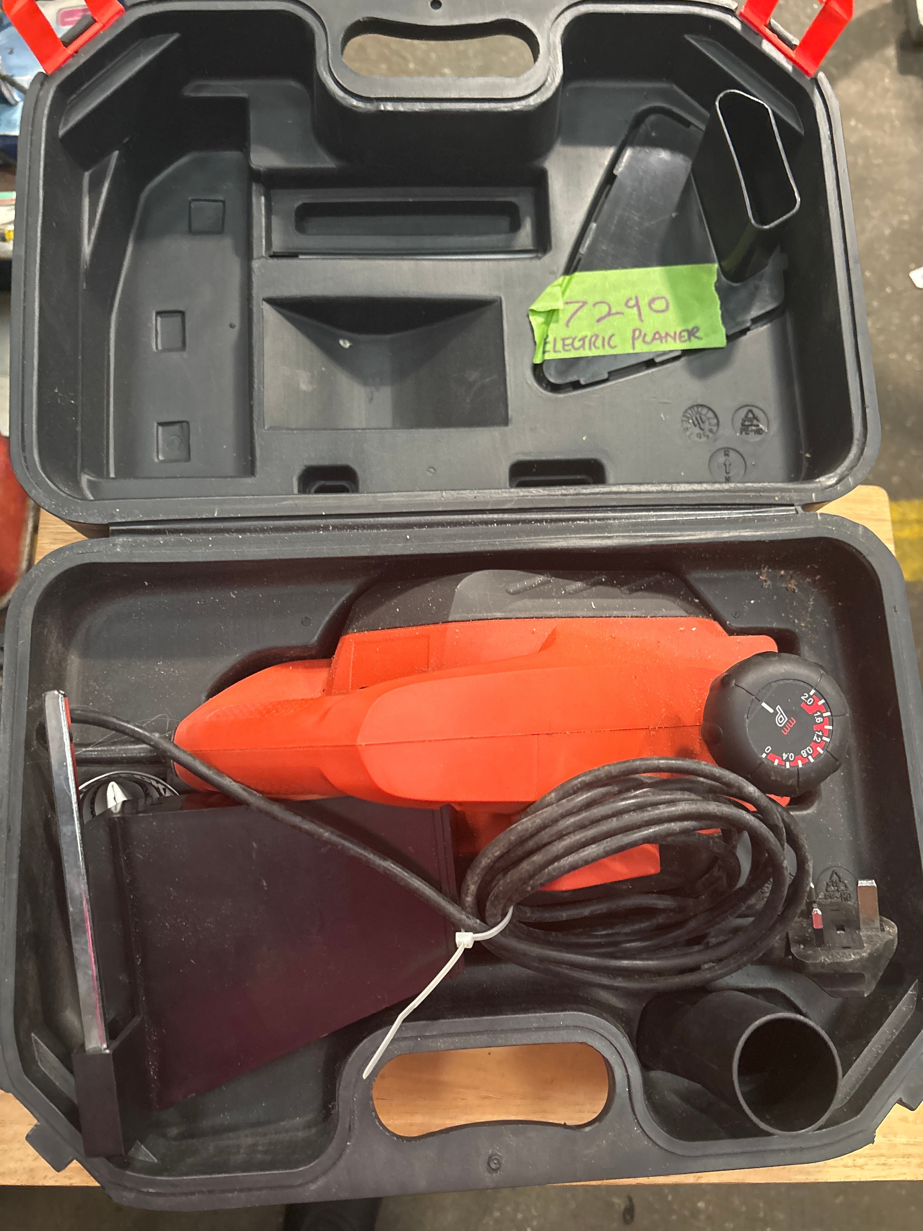 A Vintage Orange Plastic Electric Planer